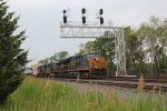 CSX 3362 takes a train under the signal bridge at milepost 58